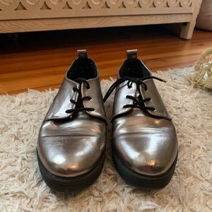 Silver and black patent leather loafers